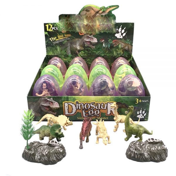 Small plastic toy dinosaur figure and skeleton model in egg